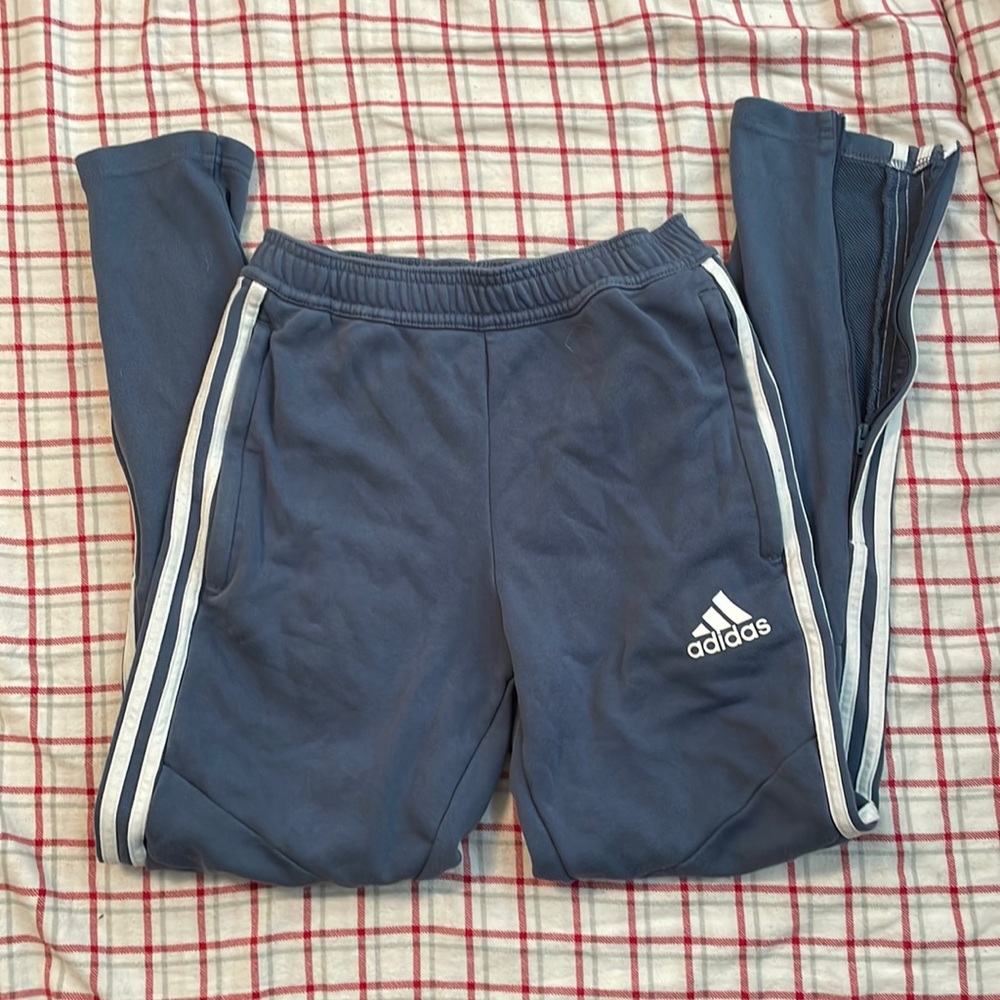 Adidas men’s joggers with zip up legs. Size extra small.
